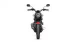 Front view of a black Yamaha motorcycle with a round headlight, dual mirrors, and a red front fender against a white background.