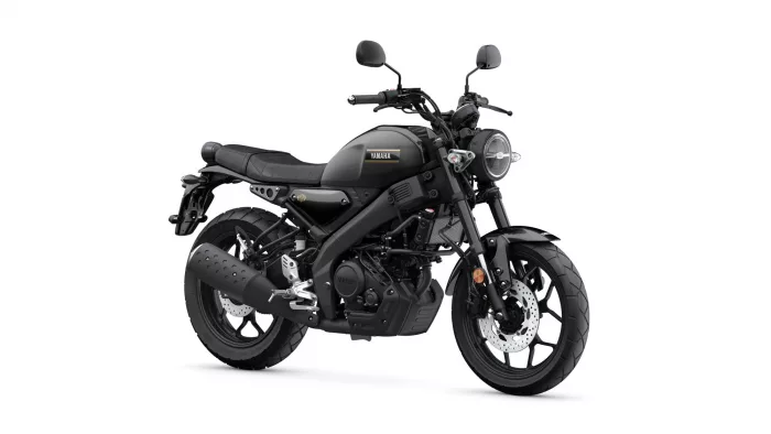 Black Yamaha motorcycle viewed from the side, showing a sleek street-bike design and round headlight on the front.