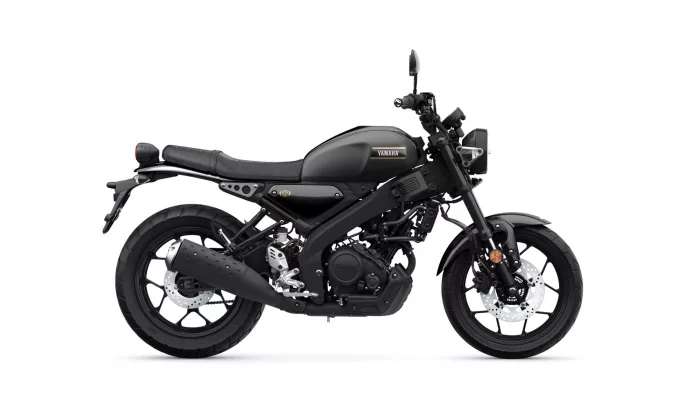 Black Yamaha motorcycle viewed from the left side, showing the fuel tank, seat, and exhaust system, on a white background.