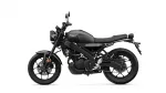 Black Yamaha motorcycle shown in side profile with sporty matte finish and red taillight detail
