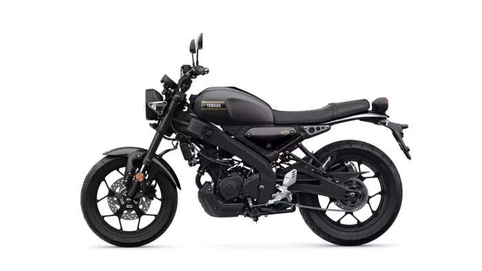 Black Yamaha motorcycle shown in side profile with sporty matte finish and red taillight detail