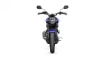 Front view of a blue Yamaha motorcycle facing the camera, with round headlight, handlebars and mirrors visible