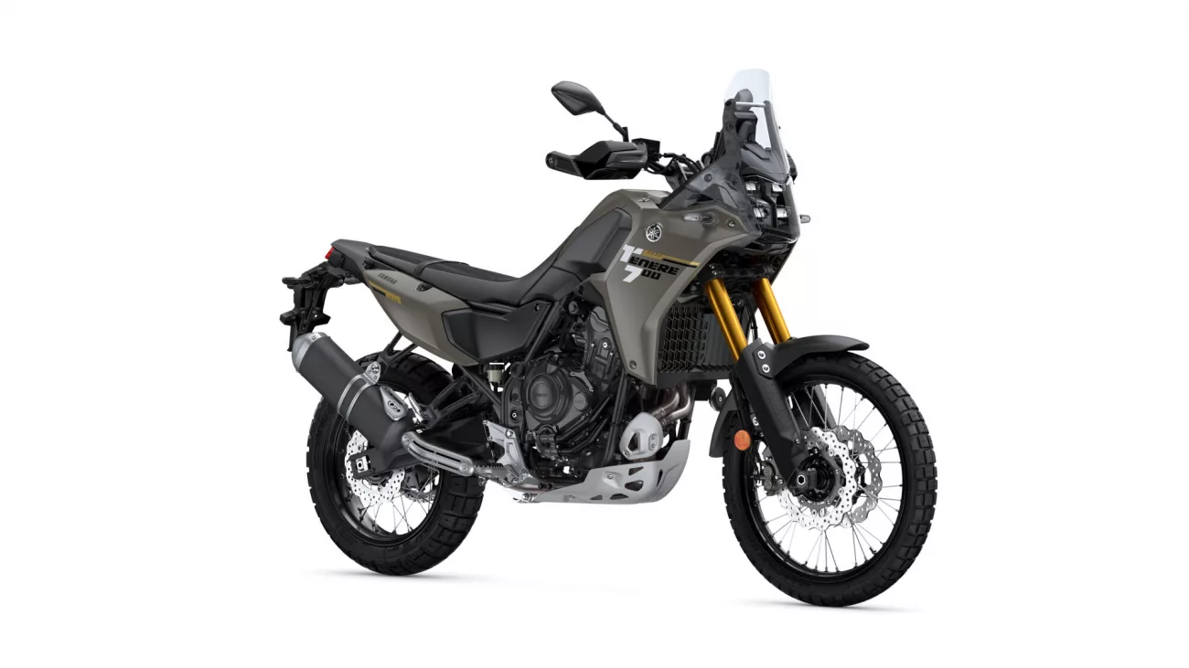 Yamaha Tenere 700 adventure motorcycle shown from a front-right angle with olive-gray body and gold front forks.",