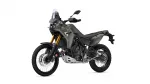 Gray Yamaha Tenere 700 adventure motorcycle, front-left side view with gold suspension forks and knobby tires.