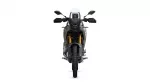 Front view of a rugged adventure motorcycle with a tall windshield and gold front forks.