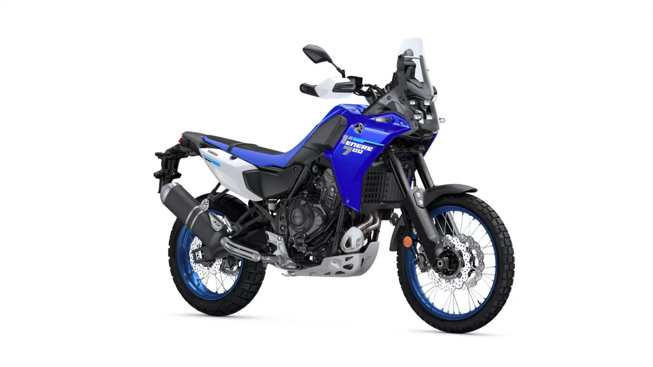 Blue Yamaha Tenere 700 adventure motorcycle viewed from a side-front angle, showing front windscreen, handlebars, and dual-sport tires