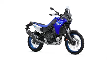 Blue Yamaha Tenere 700 adventure motorcycle viewed from a side-front angle, showing front windscreen, handlebars, and dual-sport tires