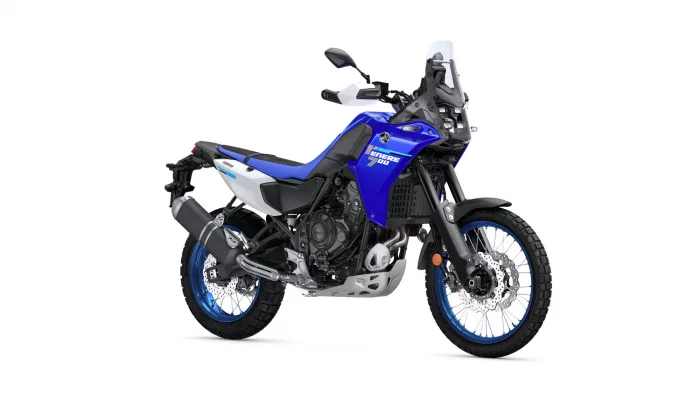 Blue Yamaha Tenere 700 adventure motorcycle viewed from a side-front angle, showing front windscreen, handlebars, and dual-sport tires