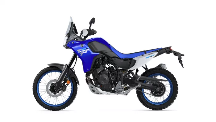 Blue Yamaha Tenere 700 adventure motorcycle shown in a side profile with off-road tires and a white rear panel.