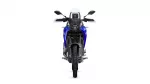 Front view of a blue adventure motorcycle with a tall windshield and black accents.