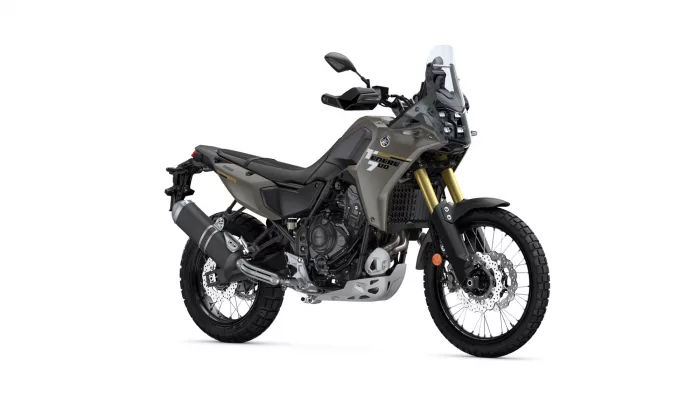 Side view of a Yamaha Tenere 700 adventure motorcycle with olive-gray body, gold front forks, and large front windscreen