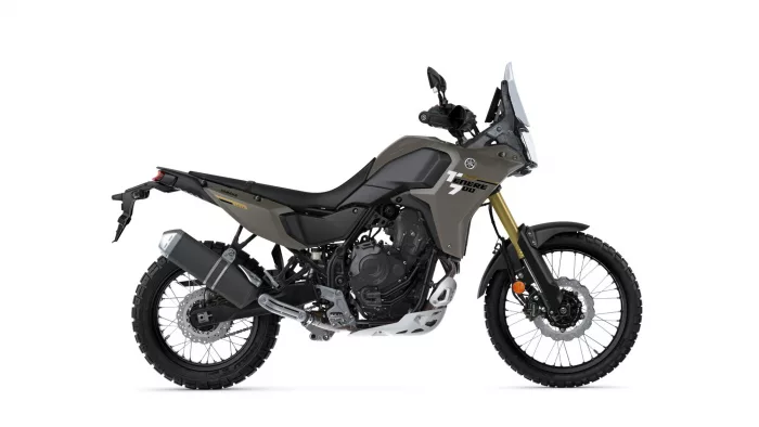 Yamaha Tenere 700 adventure motorcycle shown in a side profile with brown/gray body and gold front forks on white background