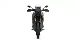 Front view of a modern adventure motorcycle with a tall windscreen, dual headlights, and gold inverted forks on a white background; rugged tire in view.