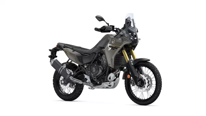 Yamaha Tenere 700 adventure motorcycle in olive gray, showing front suspension with gold forks and rugged off-road tires (side view).