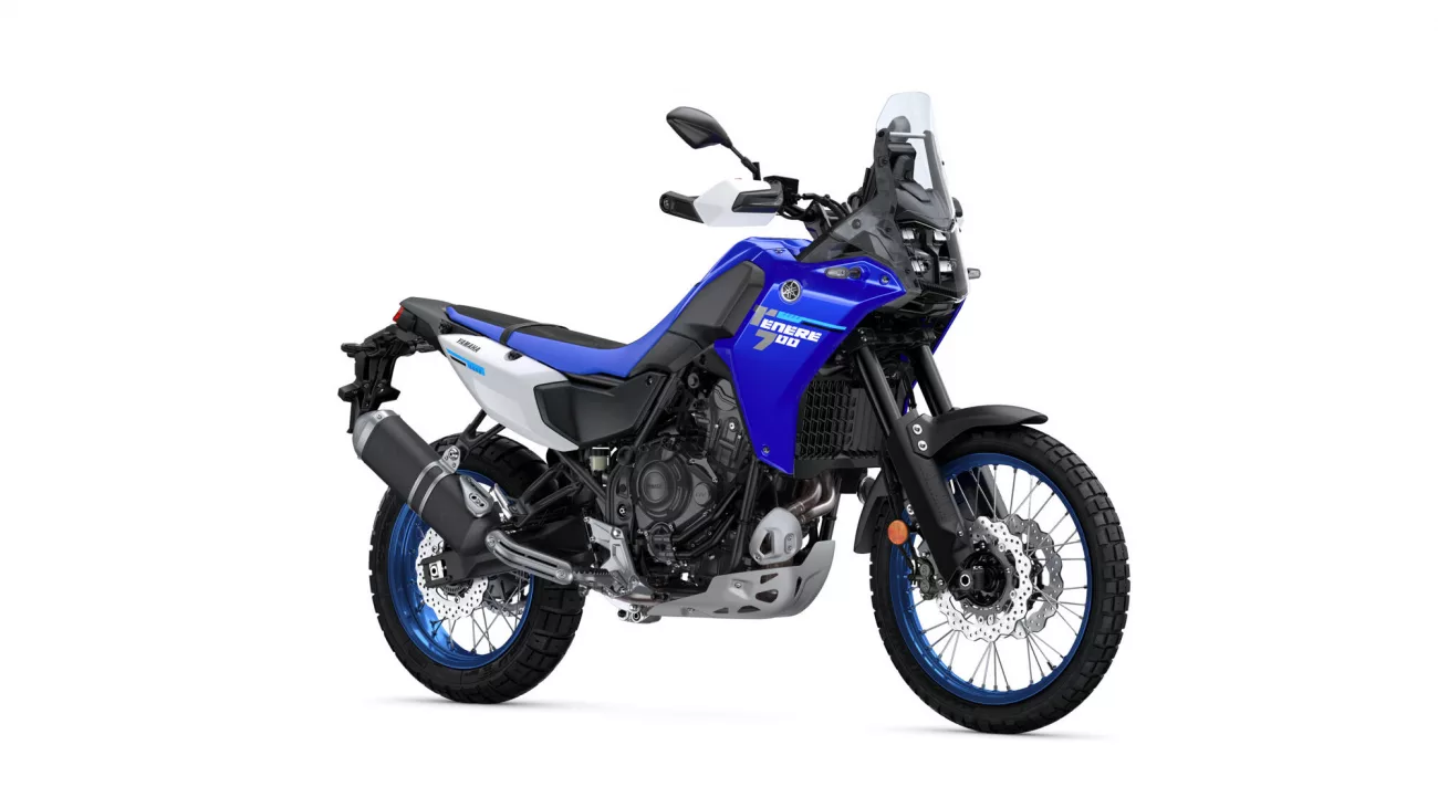 Blue Yamaha Tenere 700 adventure motorcycle shown from the left side with knobby tires and windscreen.