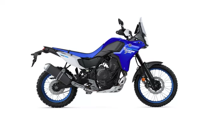 Blue Yamaha Tenere 700 adventure motorcycle shown in side profile with windshield and off-road tires