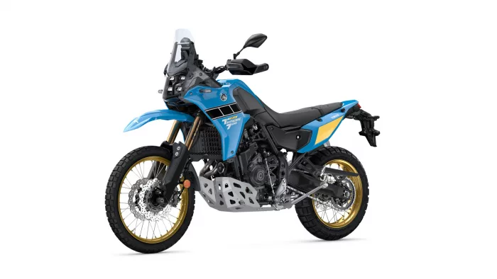 Blue Yamaha Tenere 700 adventure motorcycle shown in a left-side profile with gold front forks and off-road tires, white background