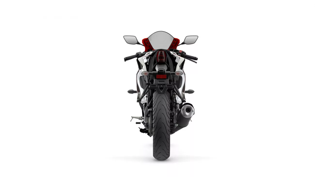 Rear view of a sport motorcycle with a single exhaust on the right and red accent seat against a white background, showing taillight and license plate area