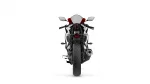 Rear view of a sport motorcycle with a single exhaust on the right and red accent seat against a white background, showing taillight and license plate area