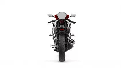 Rear view of a sport motorcycle with a single exhaust on the right and red accent seat against a white background, showing taillight and license plate area