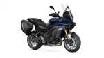 Blue Yamaha Tracer touring motorcycle with hard side panniers and tall windshield, shown in a three-quarter front view