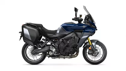Blue and gray Yamaha Tracer sport-touring motorcycle with side panniers on a white background