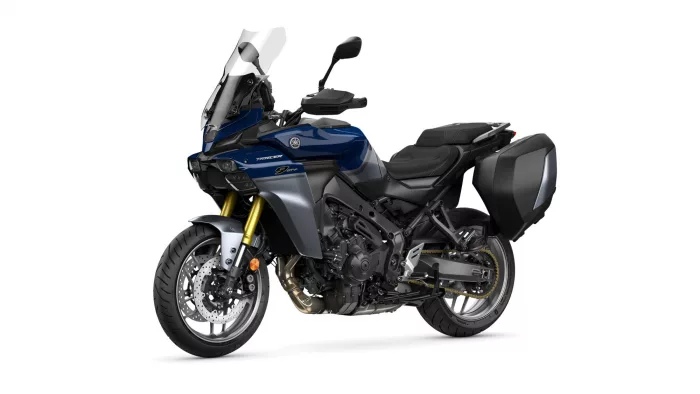 Blue Yamaha Tracer 9 GT sport-touring motorcycle with integrated side cases/panniers and tall windshield viewed from the front-left.
