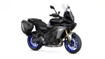 Black sport-t touring motorcycle with blue rims and side hard panniers, shown in profile with tall clear windshield and gold front forks behind.