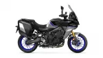 Side view of a black Yamaha Tracer 9 GT sport-touring motorcycle with blue accents and panniers.