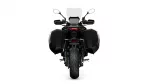 Rear view of a black adventure motorcycle with side panniers and a tall windshield, isolated on white background typically used for product photos.