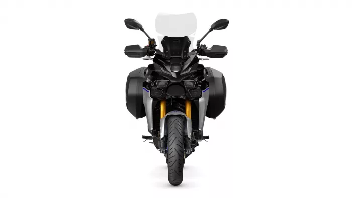 Front view of a black adventure motorcycle with side panniers and a tall windscreen