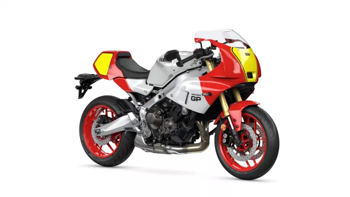 Side view of a red, white, and yellow Yamaha XSR900 GP sport motorcycle seen in profile.