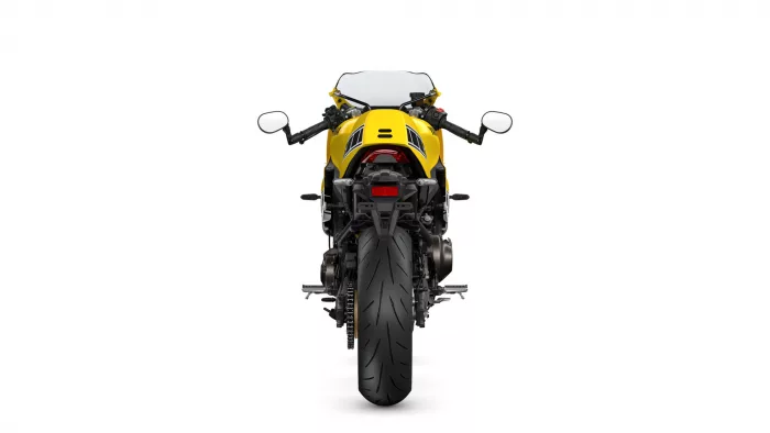 Rear view of a yellow sport motorcycle with black stripes and a wide rear tire against a white background.