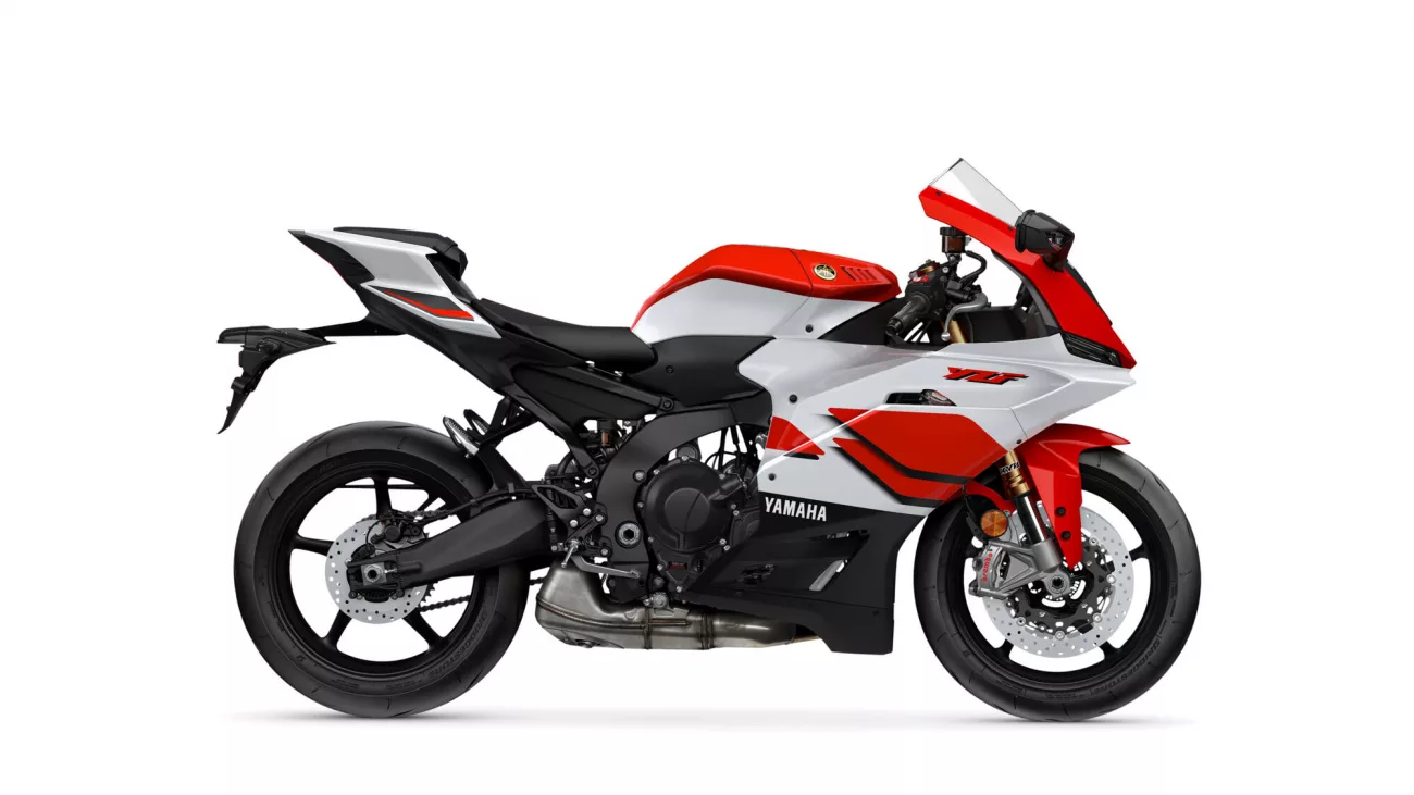 Red and white Yamaha sport motorcycle shown in a side profile with the front wheel visible.