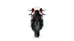 Rear view of a red, white, and black sport motorcycle on a white background.