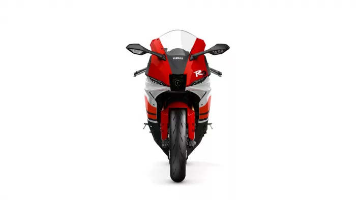 Front view of a red Yamaha sport motorcycle facing the camera, with a clear windshield and black accents on a white background.