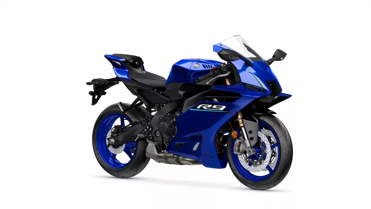 Front three-quarter view of a blue Yamaha R9 sport motorcycle with black accents and a clear windshield on a white background.