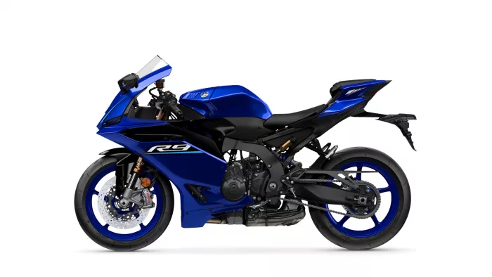 Blue sport motorcycle shown in a left-side profile with aerodynamic fairings and windshield on a white background.