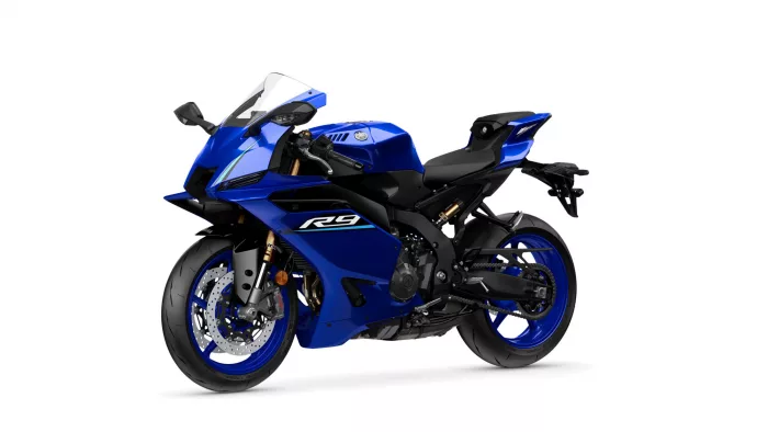 Blue Yamaha sport motorcycle (R6) shown from a front-left angle on a white background with visible disc brakes and windshield.