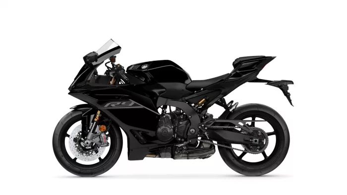 Black sport motorcycle shown in a side profile on a white background, highlighting its aerodynamic fairings and wheels, with a low-slung tail.](No trailing text)