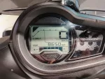 Yamaha motorcycle dashboard showing V-Belt indicator, speed 0 km/h, and trip distance 8650 km.