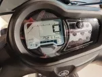 Yamaha motorcycle dashboard: digital speed readout at 0 km/h, odometer 7,211 km, fuel gauge near empty.